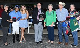 The winning connections of Dr Pepper 123 accept the Sam Houston Derby-G3 trophy on Saturday at Sam Houston Race Park