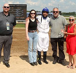 The winning connections of Nachor Secret accept the Easys Night Beat Overnight Stakes trophy at Horseshoe Indianapolis Saturday.