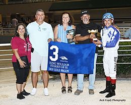 The winning connections of Rgs Gold Wagon accept the King Williams Stakes trophy at Retama Park on Saturday.