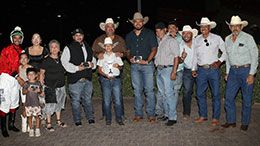 The winning connections of Toby Sis accept the Rainbow Oaks stakes trophy.