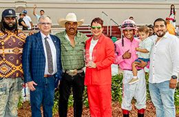 The winning connections of San Lorenzo Princess accept the LQHBA Sale Debuante Stakes trophy at Fair Grounds Race Course.