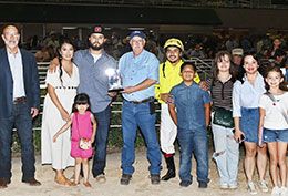 The winning connections of Holy Guacamolee accept the TQHA Sale Juvenile stakes trophy on Saturday at Retama Park.