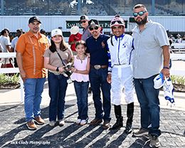 V Golden Games’s connections accept the Colors Of Texas Paint Maturity winning trophy at Sam Houston Race Park on Saturday.