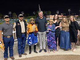 The family of Fred Scane present the Fred Scane Handicap stakes trophy to the winning connections of Beyond Repair.