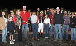 Brenda Kinsolving presents the Ochoa Stakes trophy to the winning connections of Vp Dash For Texas on Friday at Lone Star Park.