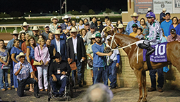 The winning connections of Point Blank Range accept the Heritage Place Derby stakes trophy on Saturday at Remington Park.