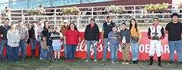 The winning connections of Ronda Rowsey accept the Mile High Futurity stakes trophy.
