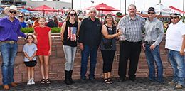 The winning connections of Chew Bac Cah accept the Hawkeye Futurity trophy Prairie Meadows on Saturday.