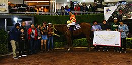 The winning connections of El Ilusionista SR accept the $54,000 Mexico Derby trophy at Hipódromo de las Américas on Sunday.