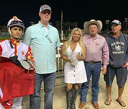 Co-owners Matt and Bindi Dunn of Dunn Ranch, Monty Arrossa and Armando Cervantes accept the Sgt. Pepper Feature Handicap stakes trophy.