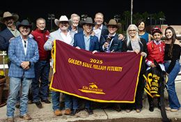 The winning connections of Enforcer accept the Golden State Million stakes trophy on Sunday night.