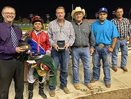 Chris Wade presents the winning connections of A Famous Ribbon the Bank of America California Championship Challenge stakes trophy