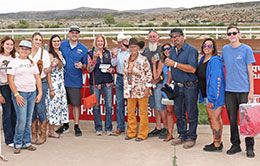 The winning connections of Divory accept the Young Ford / Wyoming Downs Derby stakes trophy on Saturday.