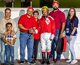 The connections of Tuckers Prize accept the trophy after winning the EVD Dash Stakes on Saturday at Evangeline Downs.