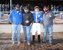 The winning connections of Alamos accept the $100,000 Lovington Stakes-G2 trophy at Zia Park on Sunday.