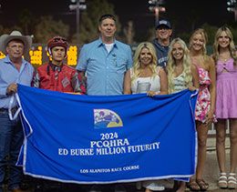Matt, Bendi and Madison Dunn of Dunn Ranch, jockey Armando Cervantes and trainer Monty Arrossa accept the Ed Burke Million stakes trophy.