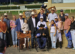 The winning connections of Chew Bac Cah accept the Heiritage Place Oaks stakes trophy on Saturday at Remington Park.