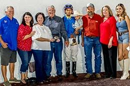 The winning connections of Franny B Dove accept the Mother's Day Stakes trophy at Delta Downs Saturday night.
