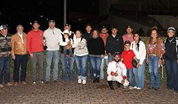 The winning connections of RLH Fouronthefloor accept the Casino at the Downs Stakes trophy at Albuquerque Downs Saturday night.