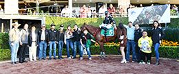 The winning connections of Br Chivali Nazareno accept the Merced Gomez Orozco Classic trophy at the Hipodromo de las Americas on Sunday.
