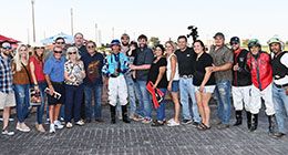 The winning connections of Royal Candy King accept the Jim Bader Futurity stakes trophy on Saturday.
