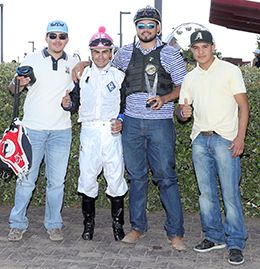 Paige's winning connections accept the Balloon City Stakes trophy at the Downs at Albuquerque on Sunday.