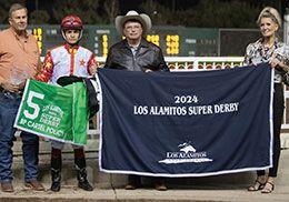 Bobby Price (left), with trainer Monty Arrossa and jockey Armando Cervantes, accepts the Los Alamitos Super Derby trophy on behalf his father Bill Price.