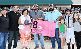 The winning connections of Osc Is On Fire accept the Colors Of The Alamo Paint & Appaloosa Futurity stakes trophy.