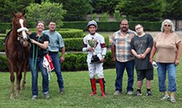 The winning connections of Fate Zoomin accept the $26,102 (US) Stallion Auction Futurity at Ajax Downs on Wednesday.