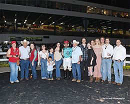 The winning connections of Jess Cartel Blue accept the $52,000 Leon Bard Memorial Stakes trophy at Sam Houston on Saturday.