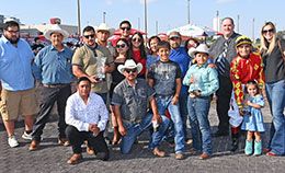 The winning connections of Ab Boogie accept the Terrace Hill Stakes trophy at Prairie Meadows on Saturday.