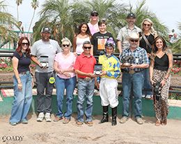 The winning connections of Shiny Nova accept the $ $37,800 Bank of America Turf Paradise Championship Challenge at Turf Paradise on Thursday.