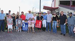 The winning connections of Classy Moon accept the Zia 870 Championship Stakes trophy on Sunday.