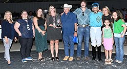The winning connections of First Time For Wine accept the $55,000 Miss Sam Houston Stakes trophy at Sam Houston Race Park on Saturday.