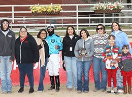 The winning connections of Yo Morning Delight accept the Pen Pal Stakes trophy Thursday at Arapahoe Park.