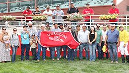 The winning connections of Mr Dash Fire accept the Pen Pal Stakes trophy at Arapahoe Park on Saturday.