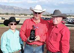 Winning owner-breeder Ezra Lee accepting the New Mexico State Fair Juvenile stakes trophy on Sunday.