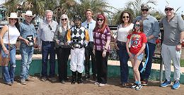 The winning connections of You Can Run accept the $40,000 Allred Brothers Stakes trophy at Turf Paradise on Sunday.