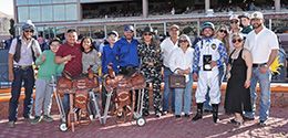 The winning connections of Traxion accept the $190,359 West Texas Derby (G3) trophy at Sunland Park on Saturday.