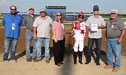 The winning connections of Streakindownthebeach accept the Air Born Leader Overnight Stakes trophy at Horseshoe Indianapolis on Thursday.