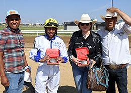The winning connections of Old Jess A Bug accept the Energy Downs QH Derby stakes trophy on Sunday afternoon.