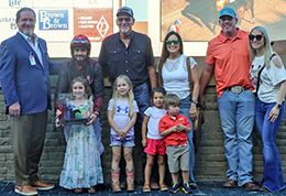 Fl Rizzo’s connections accept the Remington Park Distance Championship winning trophy at on Saturday.