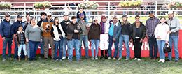 The winning connections of Presido Pete accept the Leo Beau Dash Stakes trophy at Arapahoe Park on Saturday.