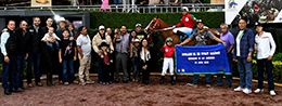 The winning connections of Mr Do Chicks accept the Garanones Futurity Consolation trophy at Hipodromo De Las Americas on Sunday.