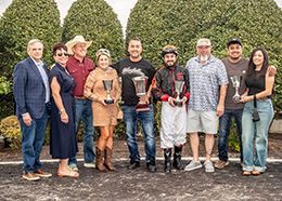 The winning connections of RF Fast Dash N Blood accept the $100,000 Mardi Gras Derby trophy at Louisiana Downs on Friday.