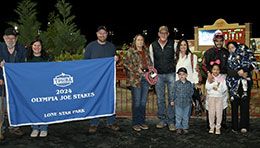 The winning connections of Livewires Turnpike accept the Olympia Joe Stakes trophy at Lone Star Park.