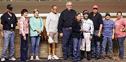 The winning connections of Jc Speeding accept the $25,000 Victoria Ennis Memorial Stakes trophy at Remington Park on Friday.