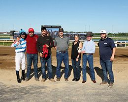 The winning connections of Mr Michel accept the $32,300 Carter Riley Overnight Stakes trophy at Horseshoe Indianapolis on Tuesday.