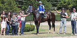 The winning connections of Had To Be Ivory accept the fifth Ontario Bred Maturity stakes trophy at Ajax Downs.