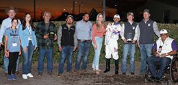 The winning connections of Noreason Fordiamonds accept the $40,000 Sandia Stakes trophy at The Downs At Albuquerque on Saturday.